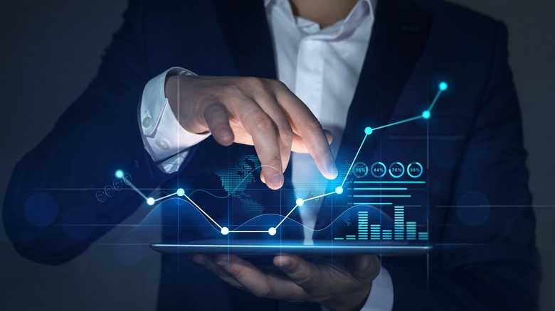man with digital financial graph model