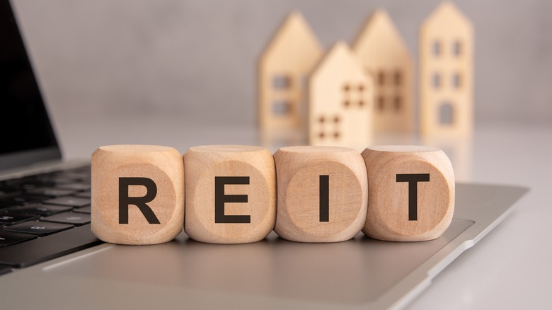 REIT spelled in blocks