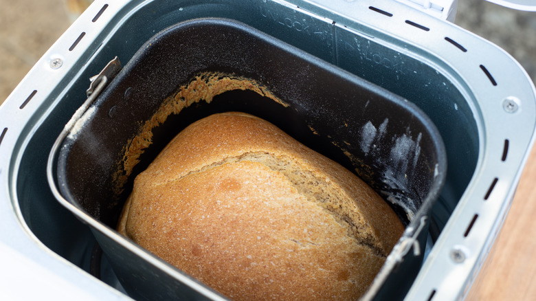 Top view of the inside a bread making machine, with cooked bread