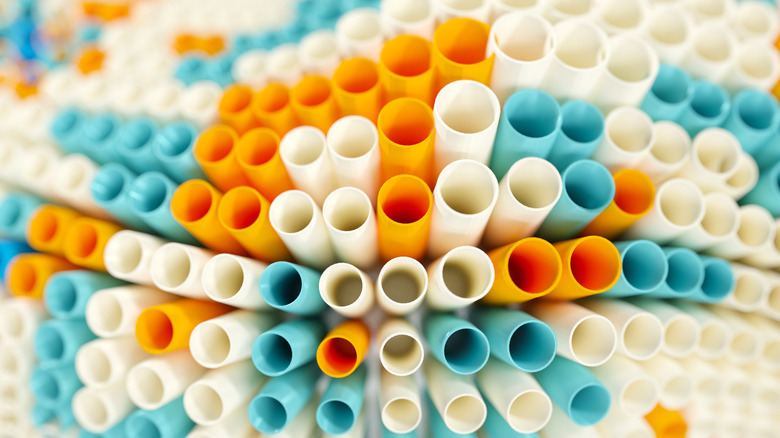 A top view of dozens of plastic straws