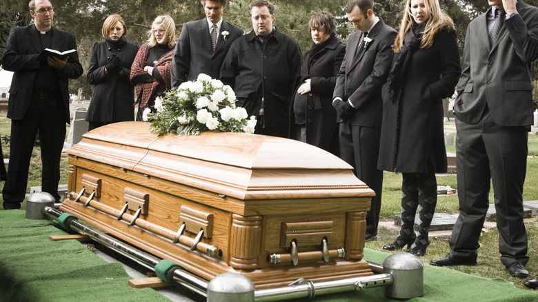 A group of people attending a funeral