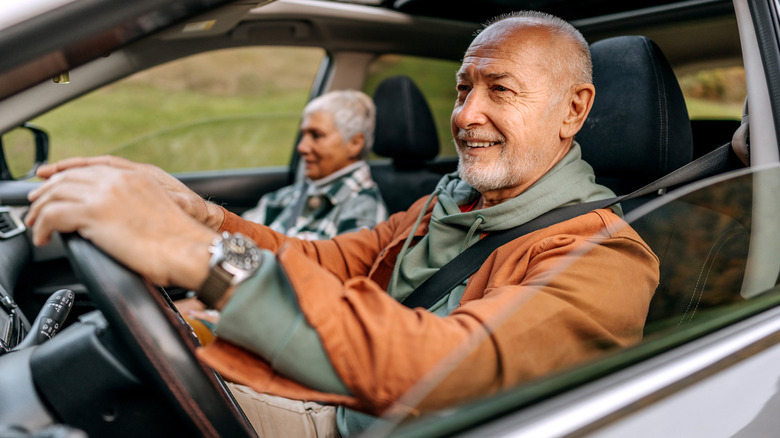 older couple driving car