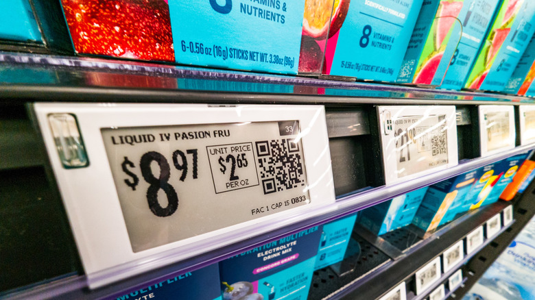 Close up of product prices on Walmart store aisle