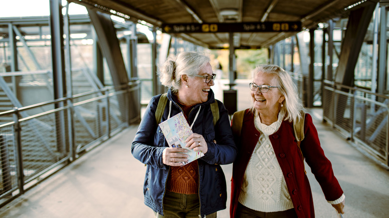 seniors walking through a train station
