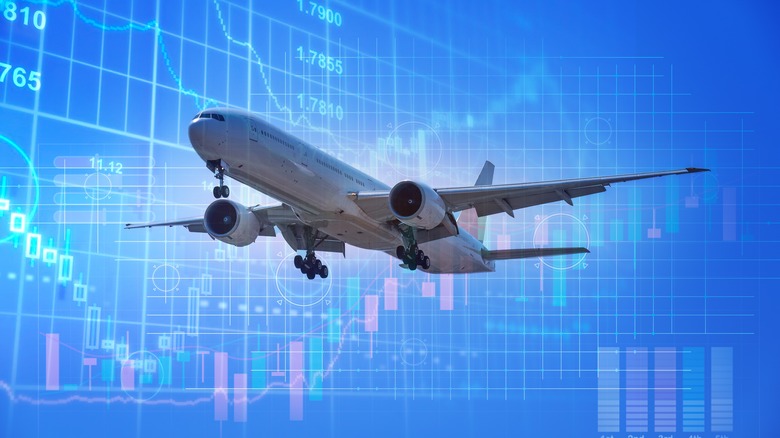 airplane over stock chart background
