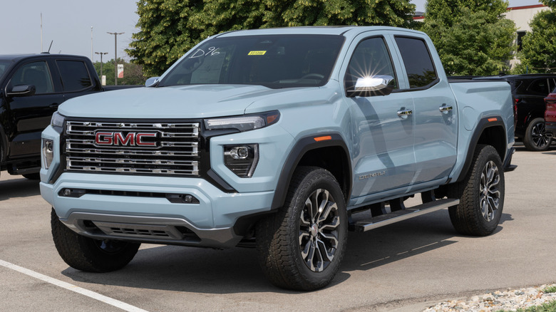 GMC Canyon 4WD Denali pickup display at a dealership.