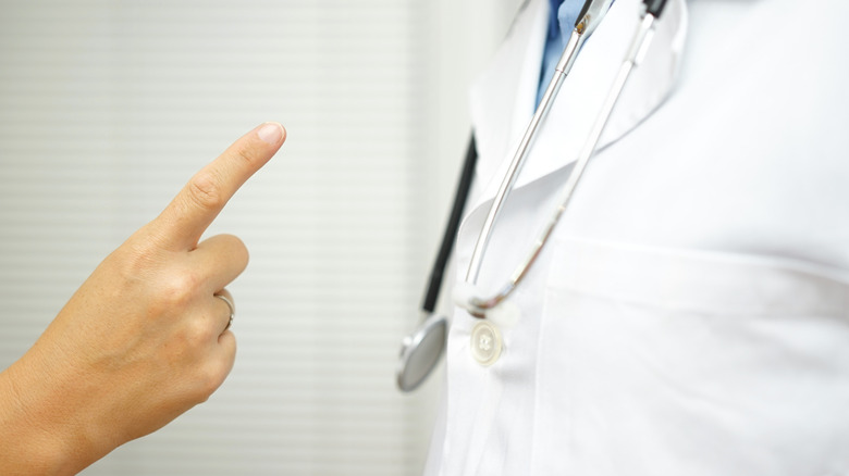 A patient is angry on doctor because of medical error.