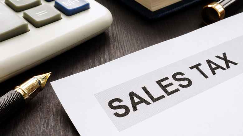 Paper on a desk that says sales tax.