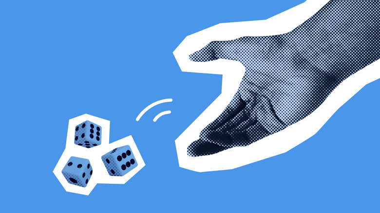 Hand rolling the dice, throwing it down.