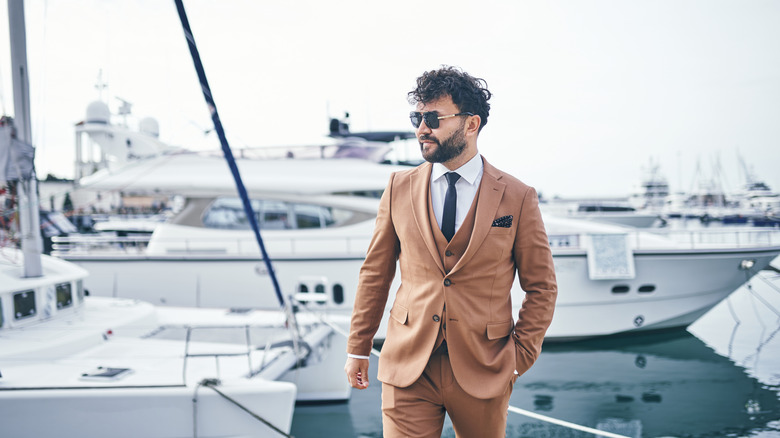 man with luxury yacht background