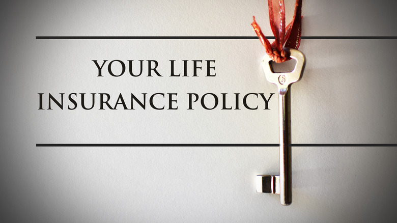 The words YOUR LIFE INSURANCE POLICY written out with a key hanging next to the text.