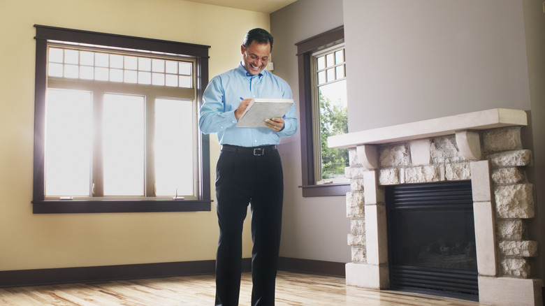 Home inspector walking through home