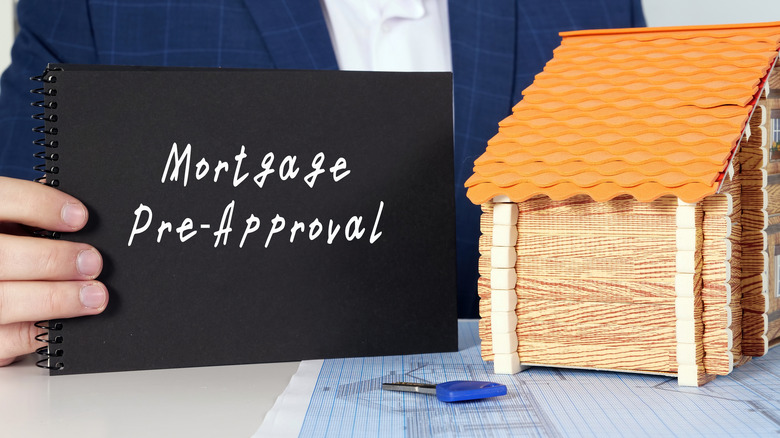 Agent holding preapproval notepad