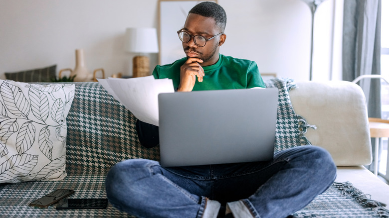 Man looking at his laptop
