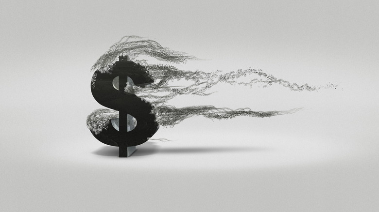 Dollar sign blowing away