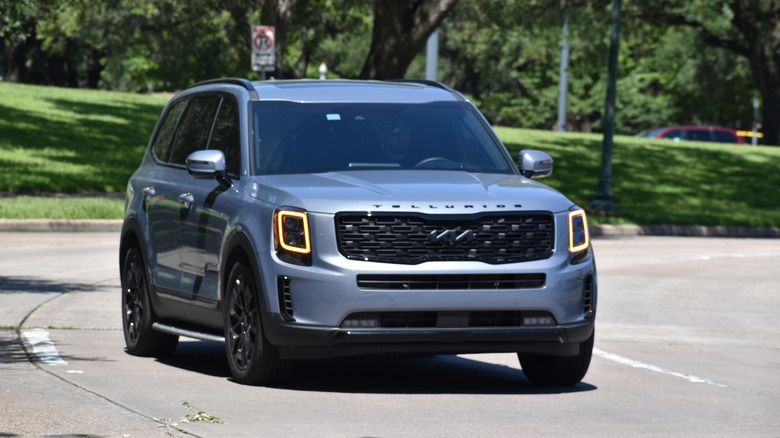 A 2025 Kia Telluride driving on the road.