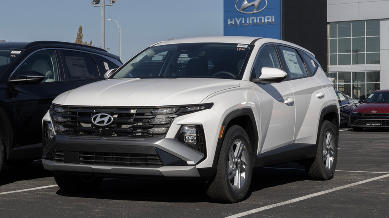 A white Hyundai Tucson SE AWD compact SUV display.