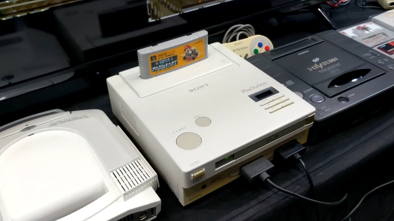 A Nintendo PlayStation Prototype next to other consoldes.