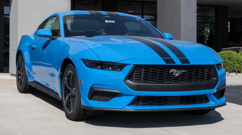 Ford Mustang EcoBoost Coupe display at a dealership.