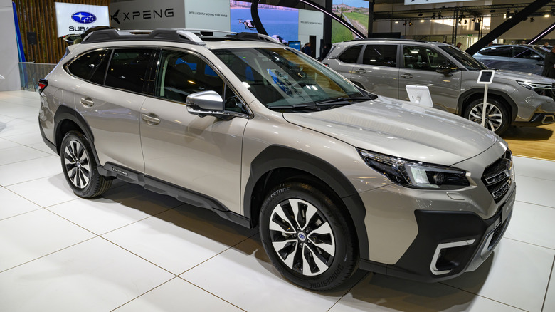 A light grey Subaru Outback 4WD station wagon on display.