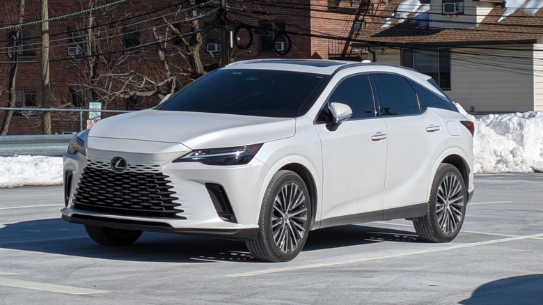 A white Lexus RX 350 AWD luxury SUV in a parking lot.