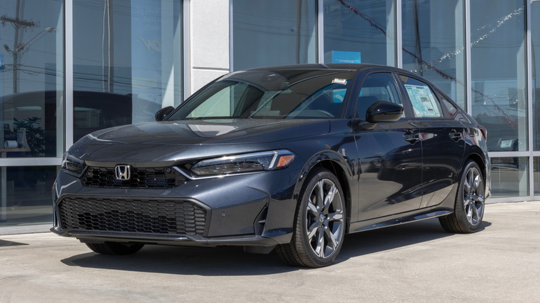 A Honda Civic Hybrid Sport Touring on display.