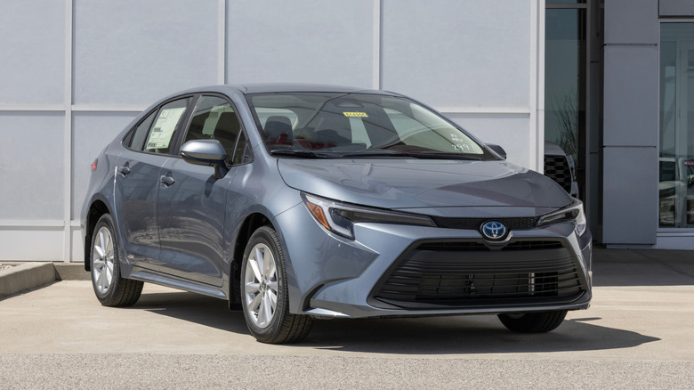A grey Toyota Corolla on display at a dealership.