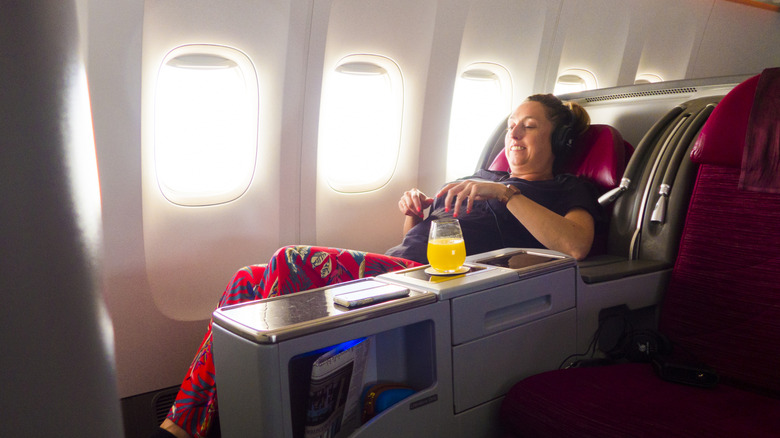 woman sitting in a first class seat