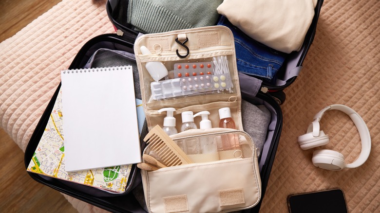 toiletries packed in a suitcase