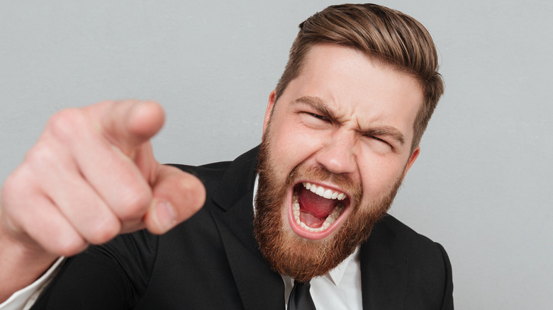 aggressive employee yelling at the boss