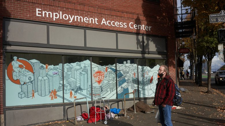 Man stands in front of employment access center office