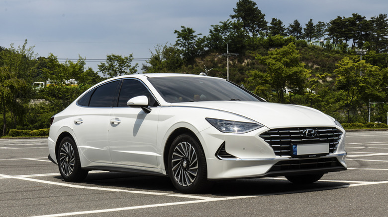 A white Hyundai Sonata in parking lot