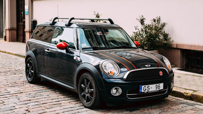 A MINI Cooper Clubman parked on a cobblestone street