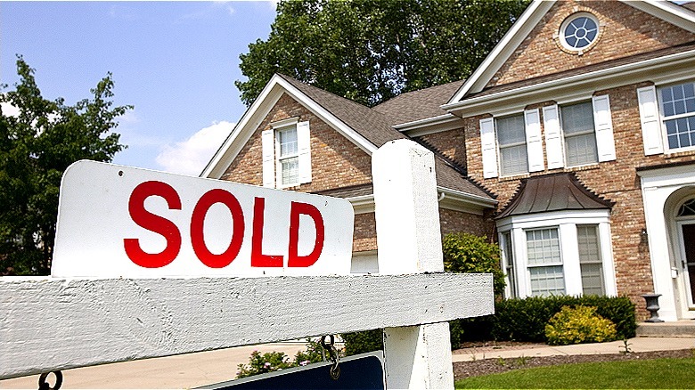 sold sign and house