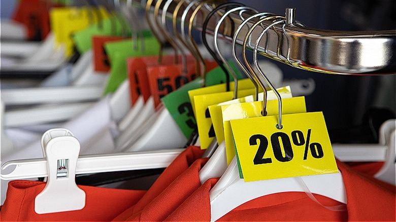 Clothing rack with discount tags