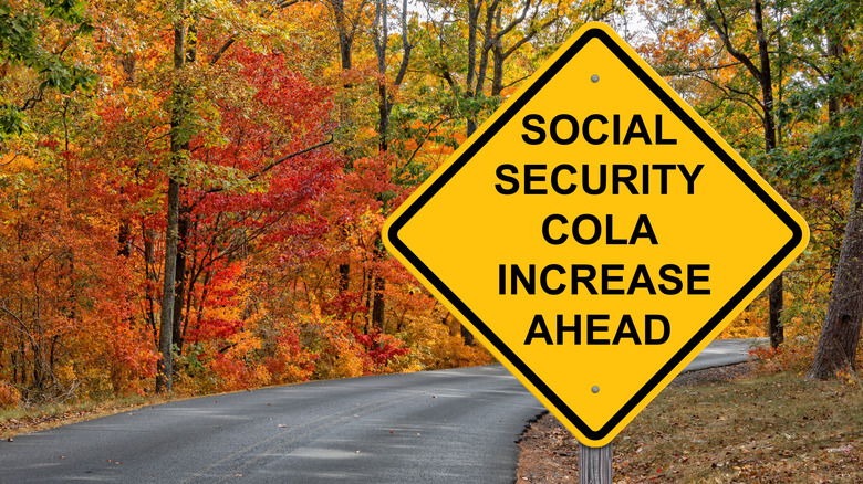 Social Security COLA Increase Ahead caution sign with an autumn background.