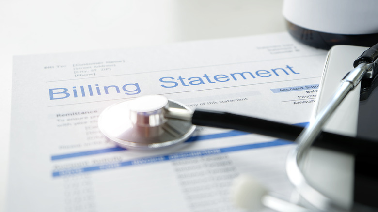 A doctor's bill and stethoscope