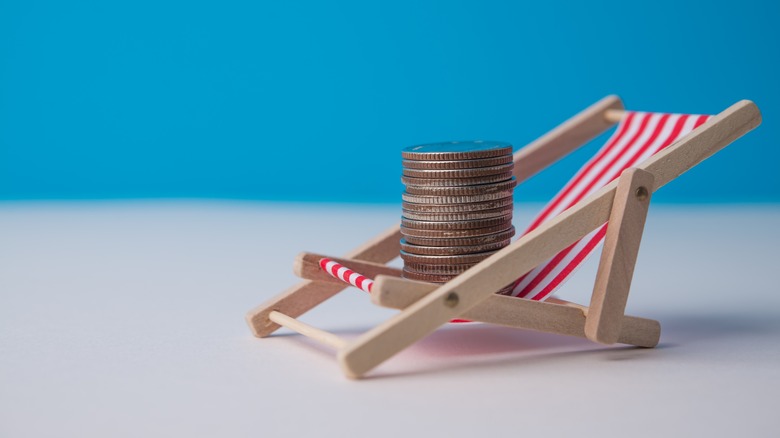 coins stacked up on a beach chair