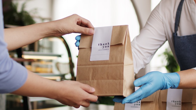 A person picking up takeout