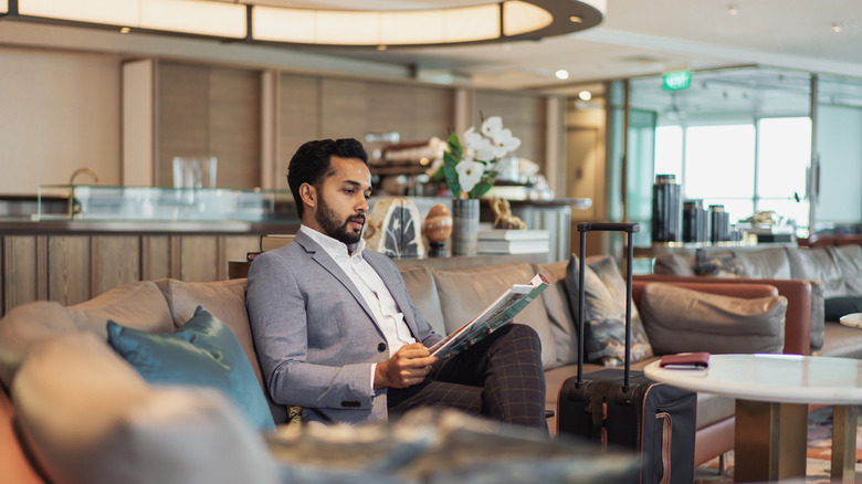 A man sitting in an airport lounge