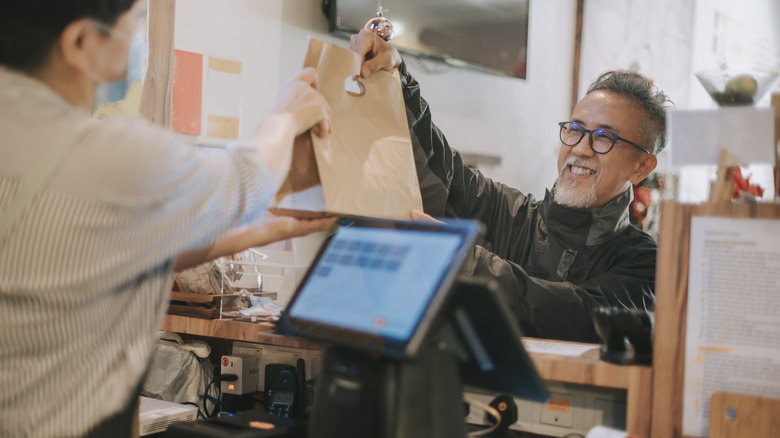 A man picking up takeout