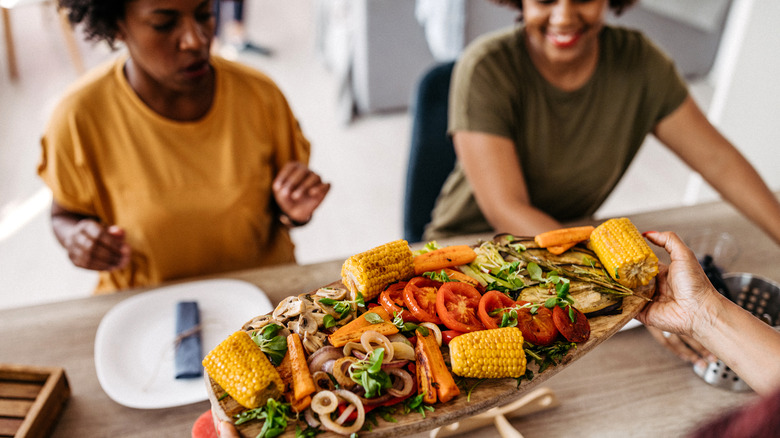 Two women being served food