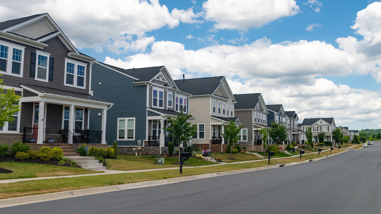 Row of new development two story houses with front garage driveway, New Neighborhoods in Leesburg, Virginia.