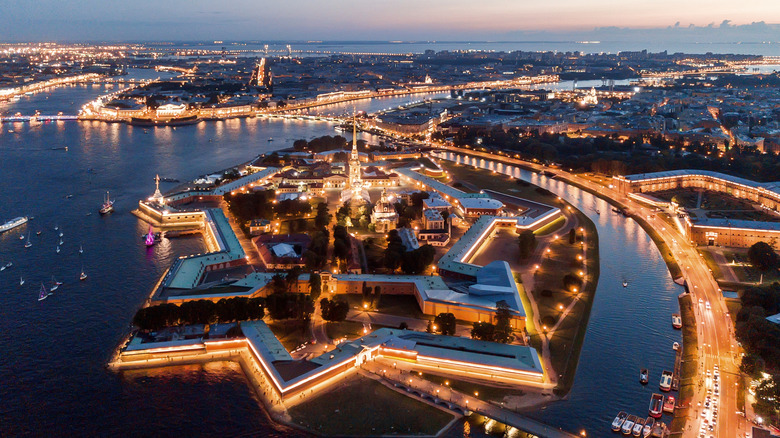 Aerial view of the night city of St. Petersburg and its Peter and Paul Fortress in Russia.