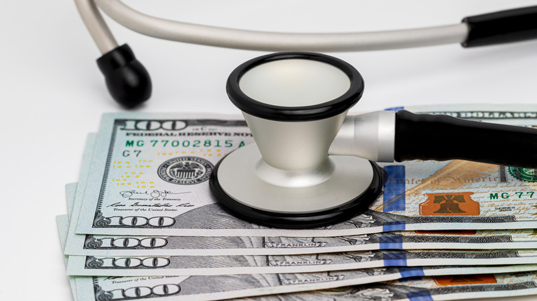 stethescope and cash