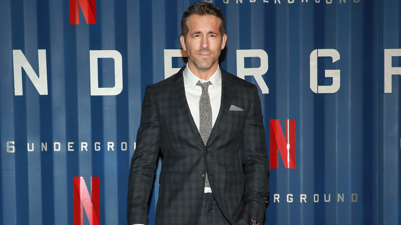 Ryan Reynolds posing for media