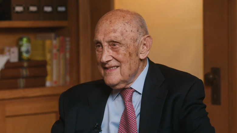 Burton G. Malkiel in suit being interviewed