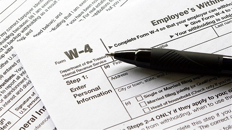 IRS form W4 with pen