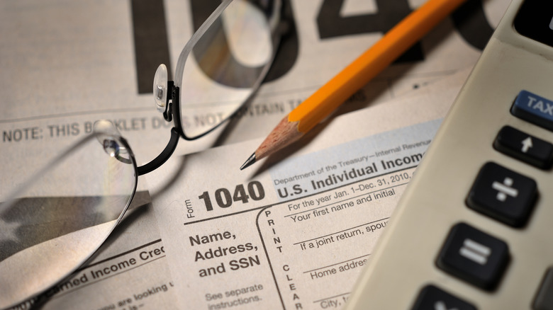 A 1040 tax form and calculator