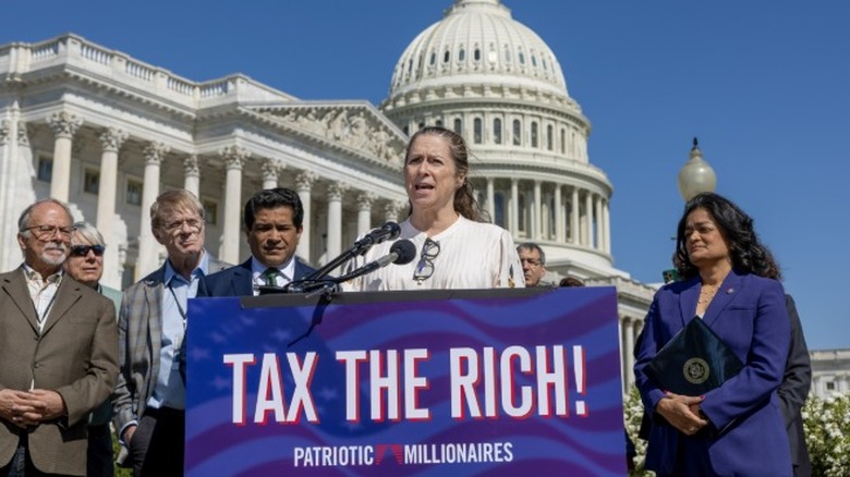Abigail Disney speaking at a Patriotic Millionaires event in 2023 in front of the U.S. Capitol building.